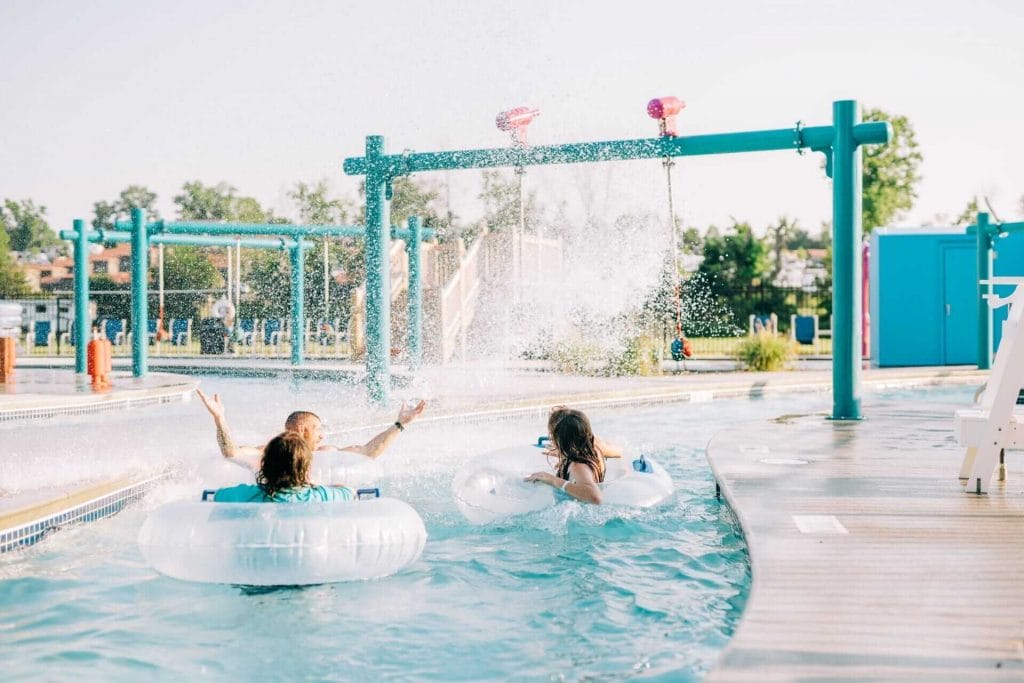 Guests enjoy the water spray from interactive features installed along the banks of the lazy river in Gardiner, New York.