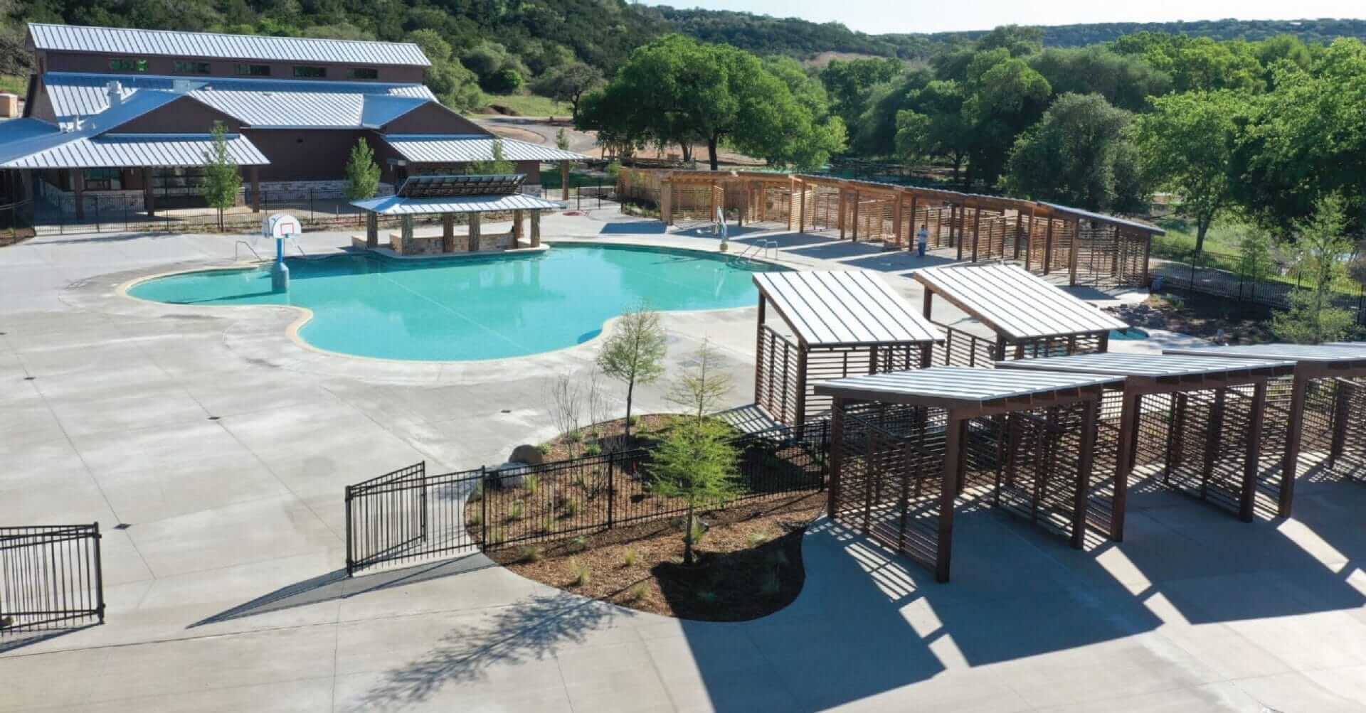 construction photo of the swim up bar and cabanas being finished at the camp fimfo in waco texas.
