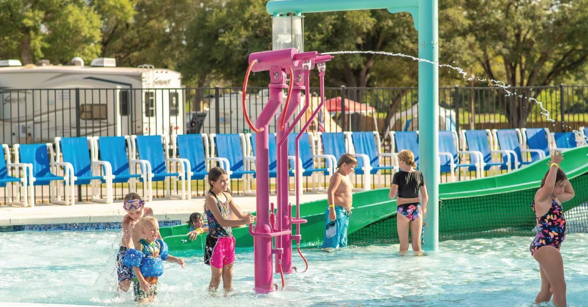 Kids play on the beanstalk blaster water toy by Interactive Play at the RV Park in Waller Texas.
