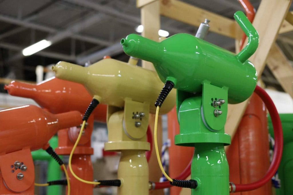 A close up shot of rusher water blasters coming off the coatings line at Interactive Play's factory in Lockport, New York.