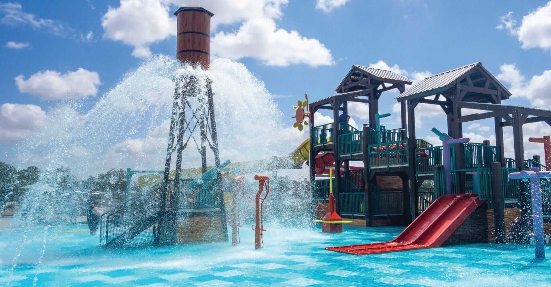 The Power Plunge water feature releases a large amount of water over the pool floor in a 360-degree spray pattern at the Camp Fimfo in Waco Texas.